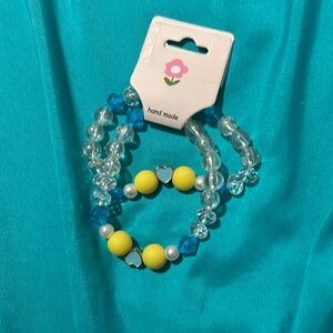 Matching blue and yellow bracelets 🩵💛